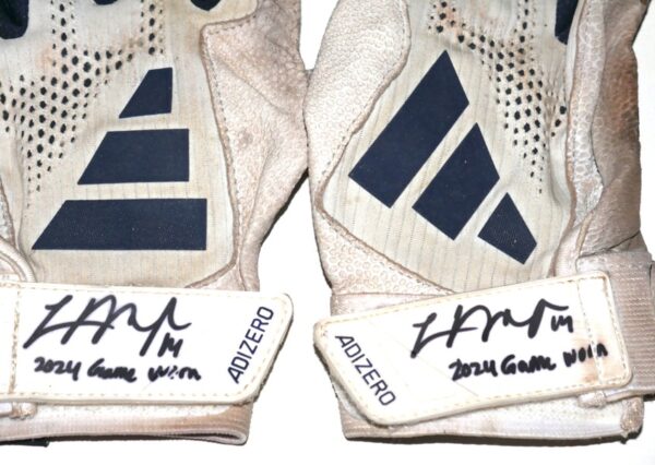 The featured white and blue Adidas Adizero Baseball Gloves were game worn by Logan O’Hoppe in 2024 as a member of the Los Angeles Angels. O'Hoppe played in 136 Games for the Angels and hit 20 Home Runs and knocked in 56 Runs. The talented catcher signed the Gloves and added his number “14” and “2024 Game Worn” in black. His number "14" is also written in black on the inside wristband. The Gloves show good use and were obtained directly from Logan O’Hoppe! Awesome Gamers from one of MLB's Top Catchers!!!